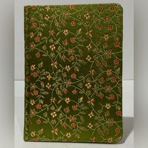 Silk like fabric covered blank notebook. Green/gold with flower design.